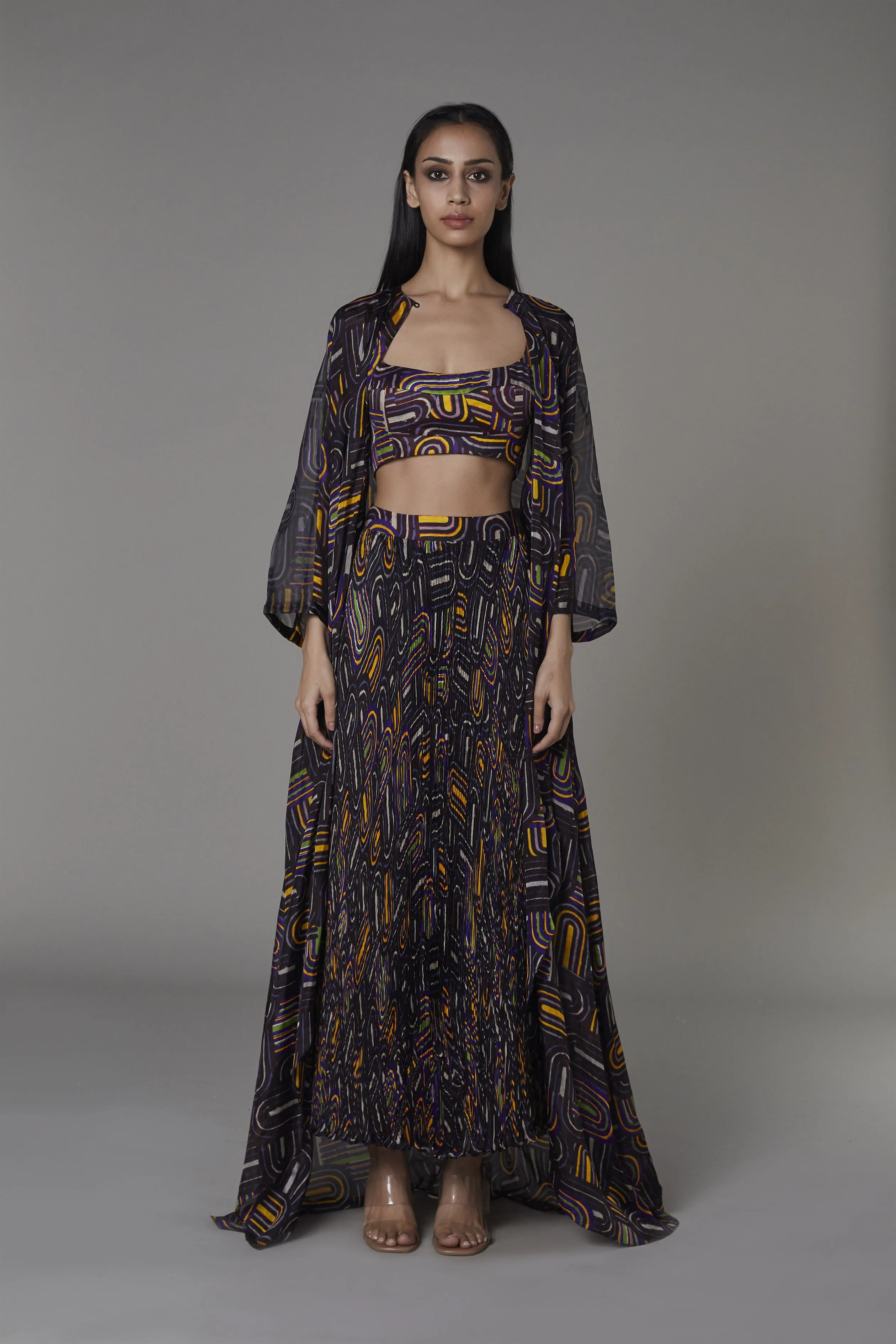 Saaksha & KinniÂ    I   Purple semi circle cape  Purple semi circle satin bustier  Purple semi circle pleated skirt Cape - Chiffon   Bustier - Satin  Skirt - Chiffon Purple SS22126    SS22093    SS22127
